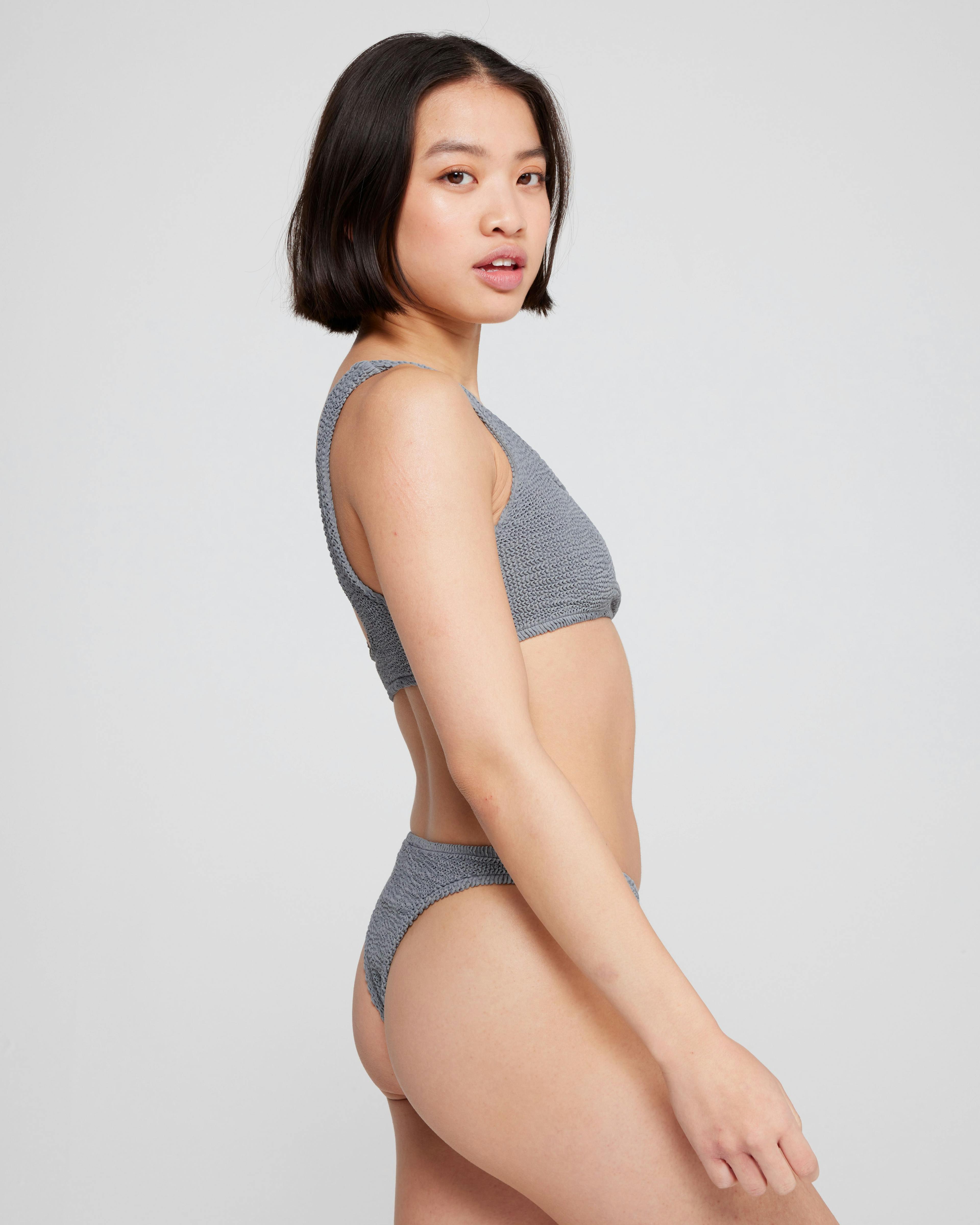 A model wearing Aplomb Cheeky Two-Piece